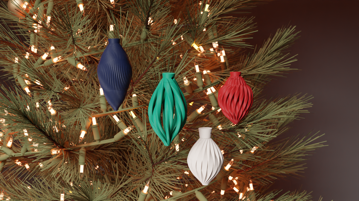 Set of 4 small 70mm Christmas baubles hanging on a tree