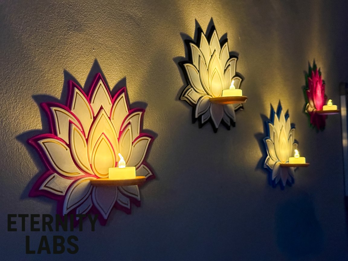 Layered lotus flower wall tealight holder glowing with an LED tea light