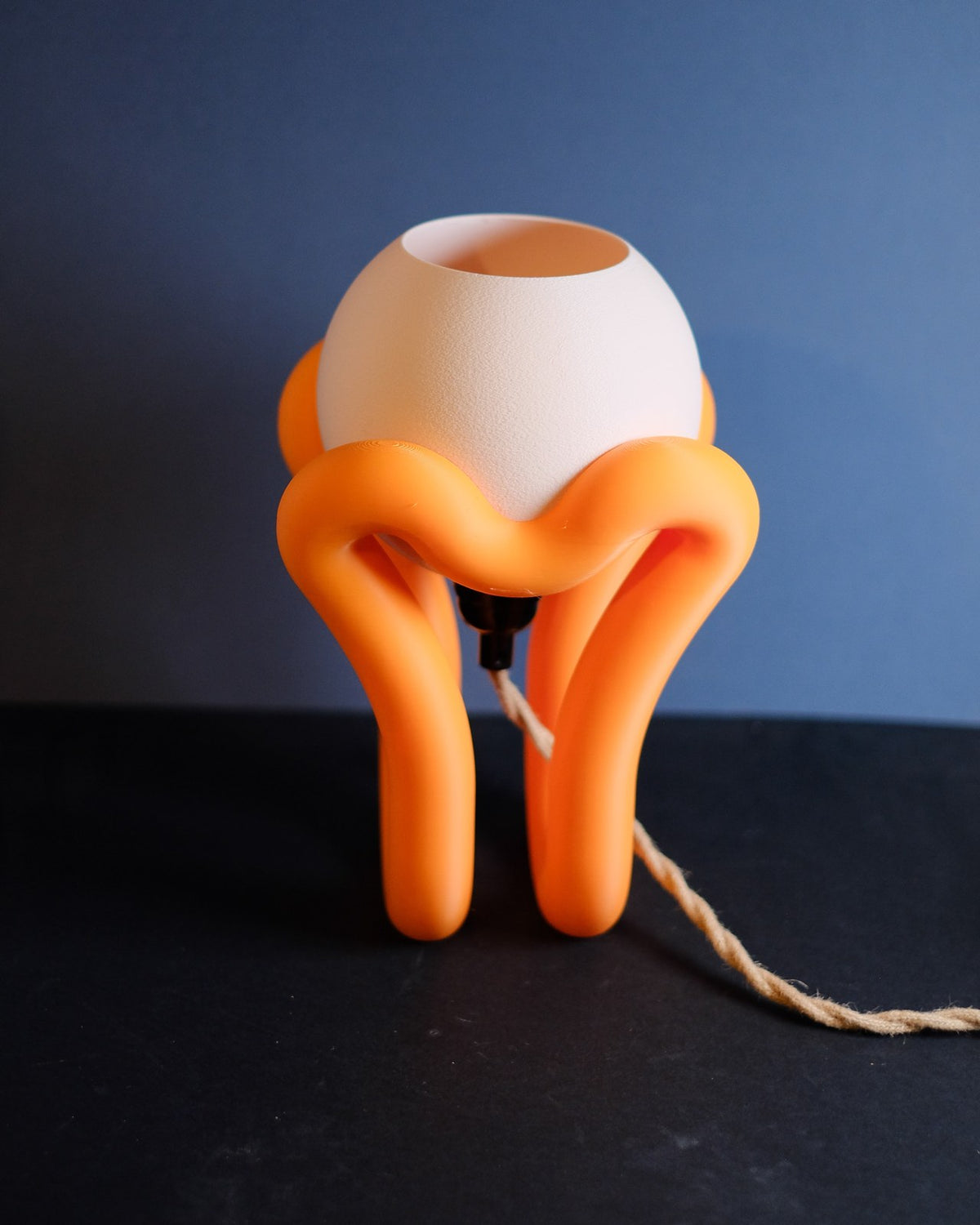 Floating wibble sphere table lamp unlit, orange stand with white sphere shade