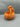 Orange monster hand pumpkin candy bowl, angled side view of the claw gripping the arched handle