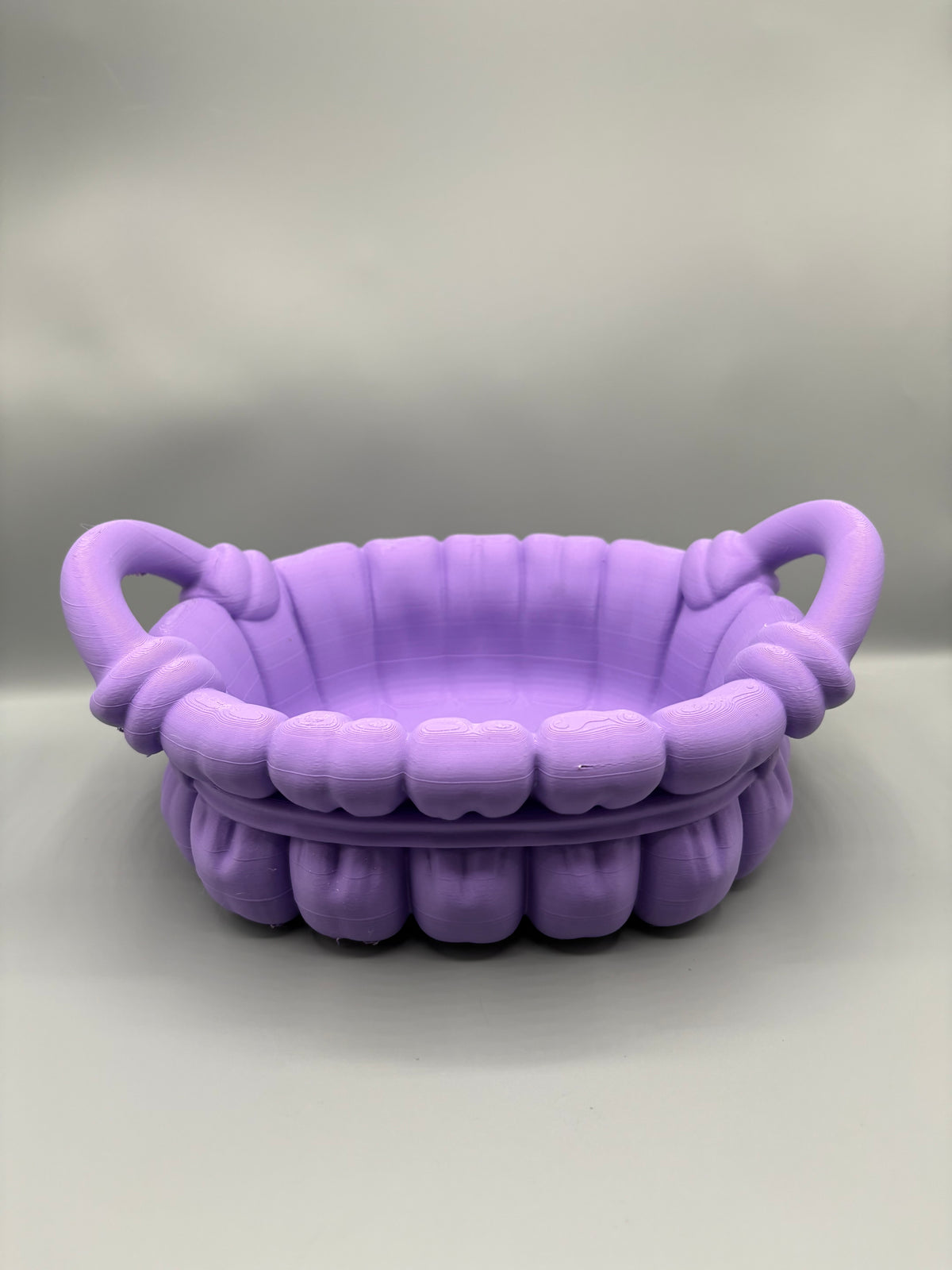 Bathroom organizer basket with knotted handles, front view