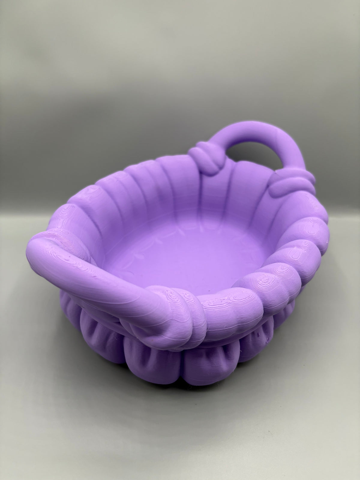 Woven-style bathroom organizer basket, angled view showing the open interior