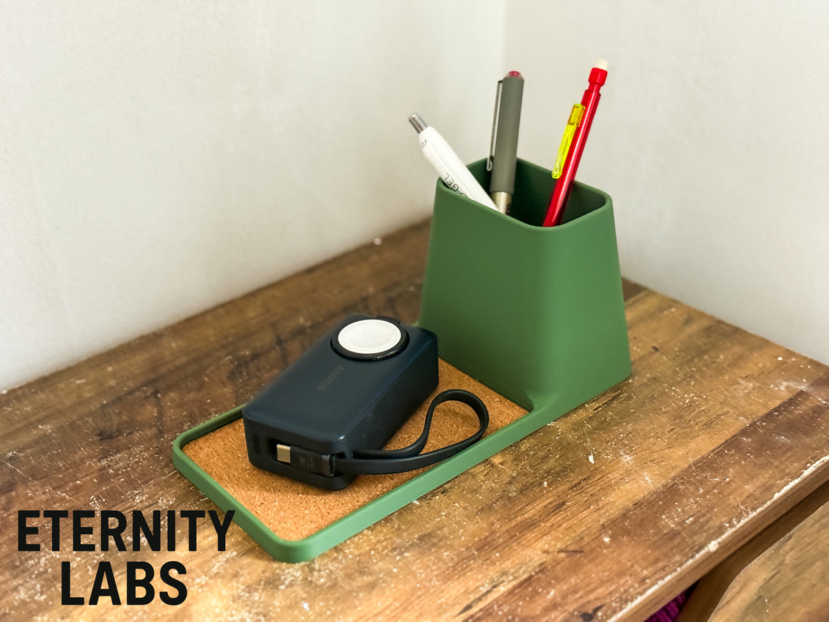 Long tray desk organizer with pen pot and a small device in the tray