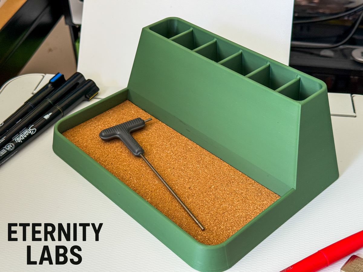 Modern desk organizer with a T-handle tool resting in the tray