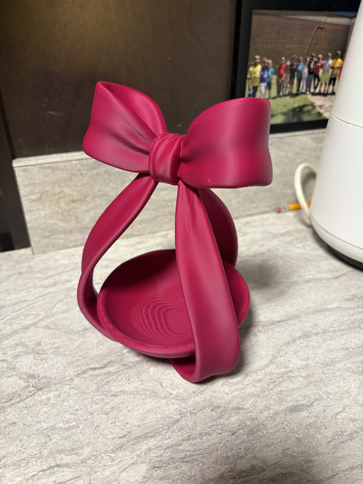 Coquette bow jewelry dish, angled view of the round ring tray under the bow