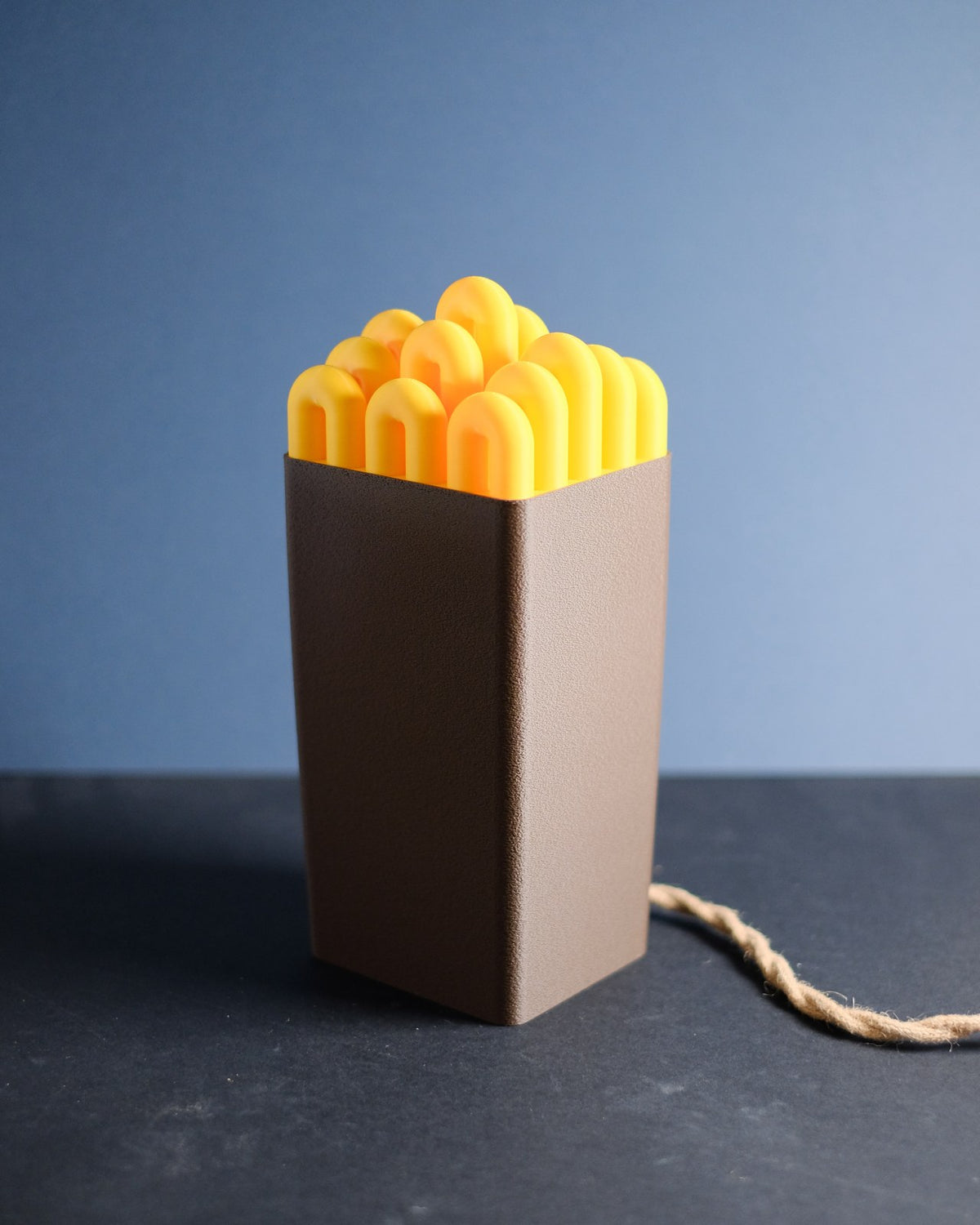 Funky wibble cap table lamp, full view of two-tone soft pink and yellow design