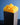Close-up of the yellow wibble-arch cap on the rectangular lamp base